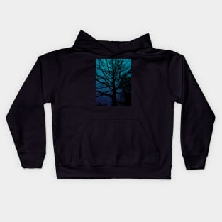 Tree silhouette on blue gradient background in the evening Kids Hoodie